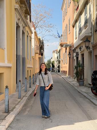 Sofia Scarselli, founder of Hala, on a quiet neoclassical street in central Athens