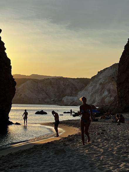 A narrow cove between pale cliffs at sunset, Milos