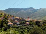 A stone village on a wooded hillside in the Mani