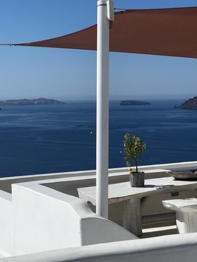 Greece — terrace with a lemon tree over the Santorini caldera