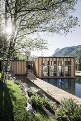 ADLER Spa Resort Dolomiti — architectural sauna pavilions over a reflecting pond