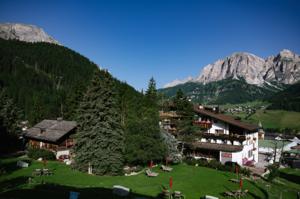 Hotel La Perla, Corvara — exterior with Sella Group dolomites behind