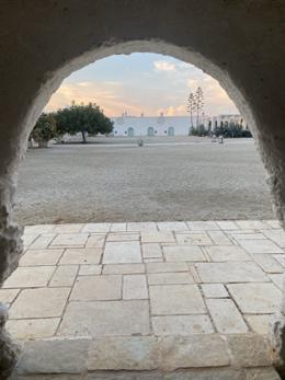 Masseria Potenti — through the arch at dusk