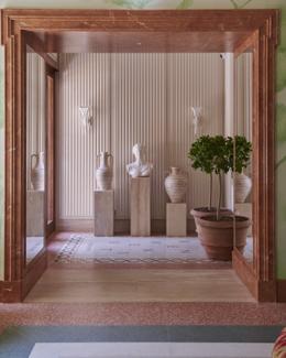 Casa Monti — entrance hall with classical busts