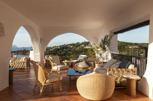 Romazzino, A Belmond Hotel — loggia with white sculpted arches opening to the Costa Smeralda sea