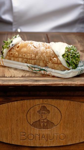 Antica Dolceria Bonajuto, Modica — a cannolo filled to order, pistachio at both ends
