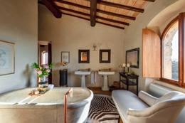 Castello di Vicarello — castle suite with stone walls