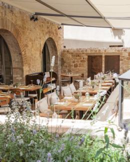 La Bandita Townhouse — Townhouse Caffè outdoor courtyard with stone arches