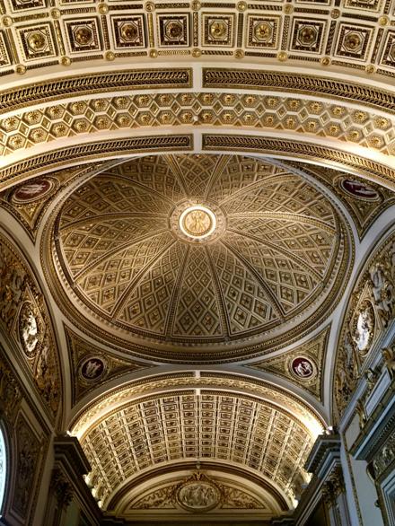A gilded coffered dome seen from directly below