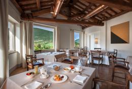 Palazzo Seneca — breakfast room with Sibillini mountain views through the windows