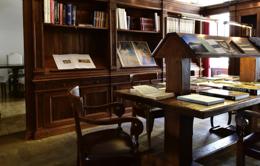 Palazzo Seneca — dark wood library with the Bianconi book collection on display