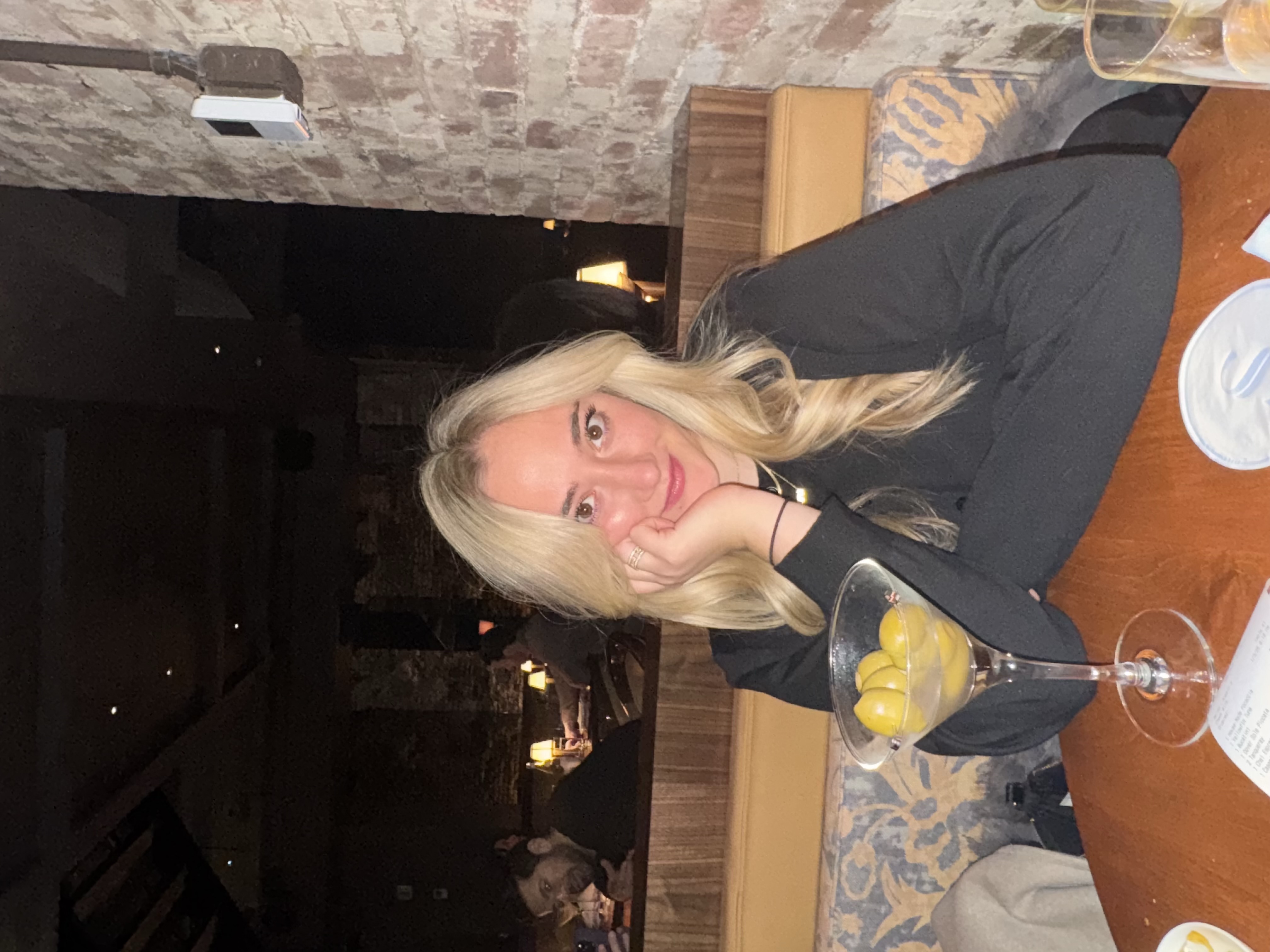 Isabella Scarselli of Hala, at a restaurant banquette with a martini