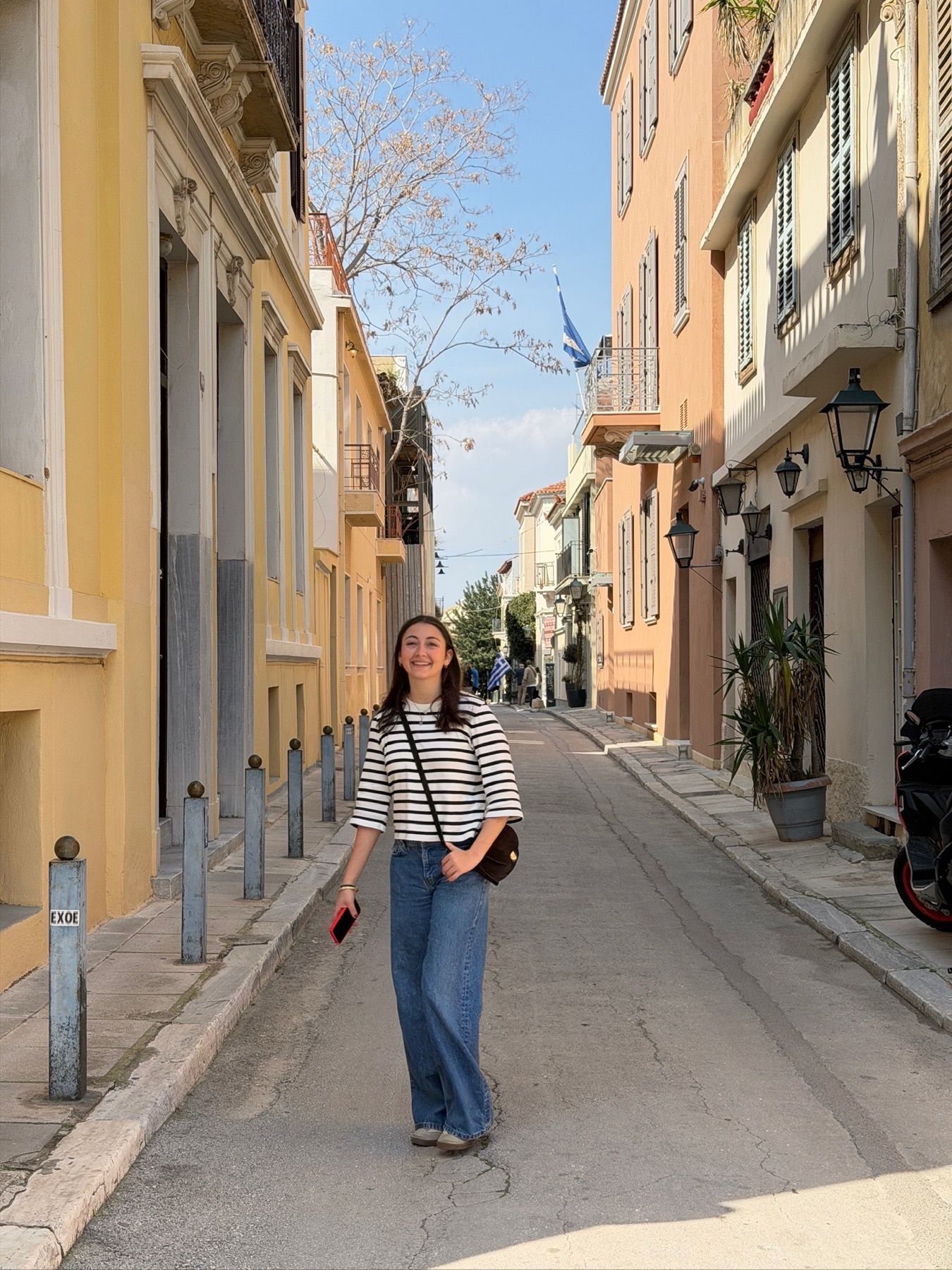 Sofia Scarselli, founder of Hala, on a quiet neoclassical street in central Athens