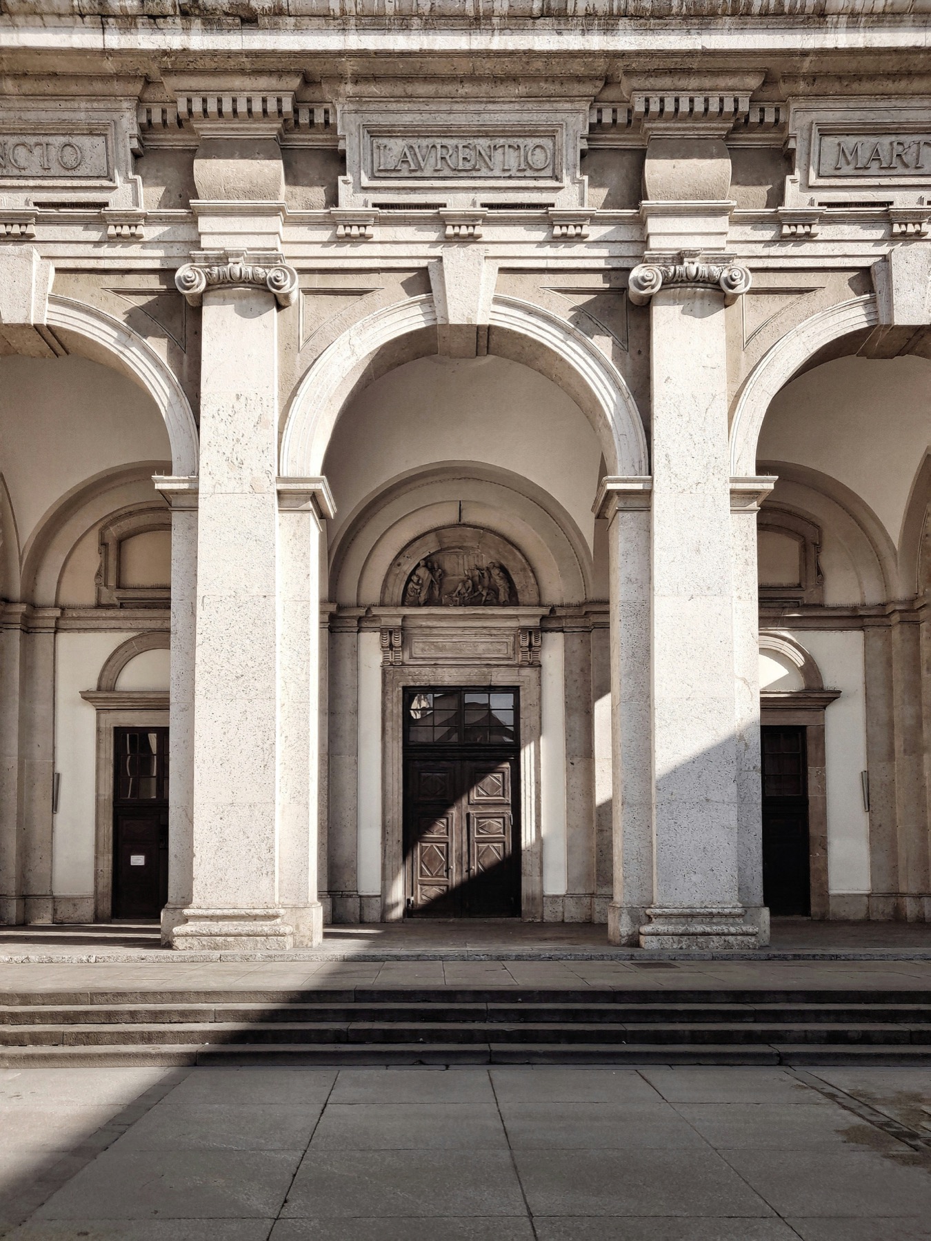 Milan classical arched portico in afternoon light