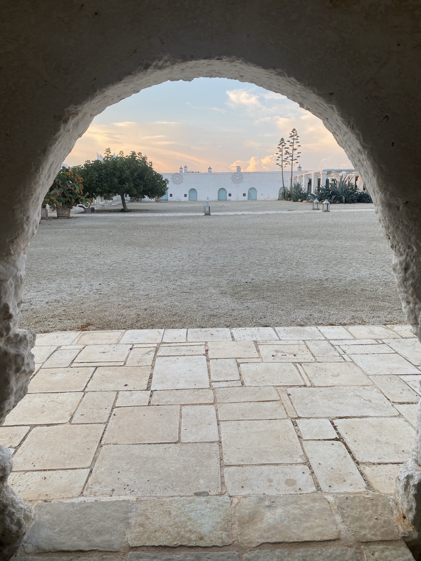 Masseria Potenti — through the arch at dusk